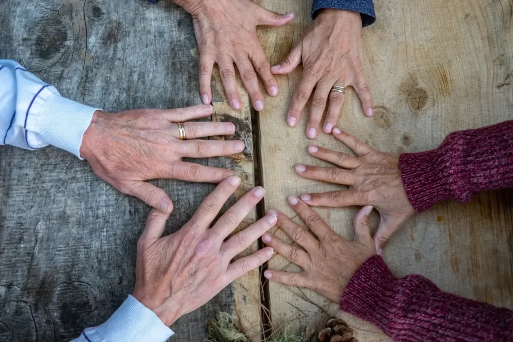 A group of women joining hands